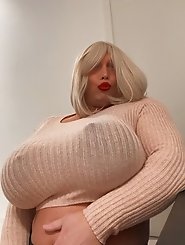 Transgender women in lingerie pose partially nude outdoors